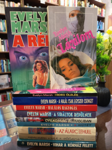 Evelyn Marsh - Evelyn Marsh k�nyvcsomag 11 darabos K�NYVMENT� AJ�NLAT: L�z�lom, A r�m, Hideg �lel�s, Hal�los ragyog�s, A hal�l csak egyszer csenget, A sir�lyok rep�lnek, Gyilkoss�g a Tivoliban, A m�t�t, Az �larc lehull, Hal�l a m�t�asztalon,Vih