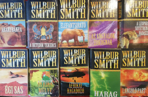 Wilbur Smith - 10 darab Wilbur Smith k�nyv, hasonl� kiad�sban (Afrikai ragadoz�, Afrika m�lye, �gi sas, Harag, L�ngol� part, Az angyalok zokognak, A leop�rd s�t�tben vad�szik, Aranyb�nya, A hetedik tekercs, Elef�ntsirat�)