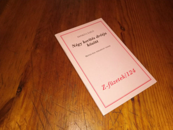 Donk� L�szl� - N�gy ker�t�s dr�tja k�z�tt